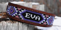 a beaded dog collar on a wooden post