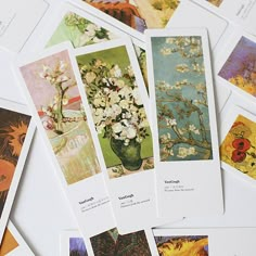 several cards with pictures of flowers in them