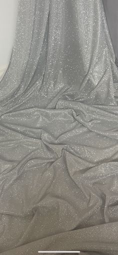 "WHITE/SILVEE MOONLIGHT GLITTER STRETCH FABRIC Product information 1 mtr white/silver moonlight glitter stretch fabric 58\" wide 147cm Moonlight fabrics are a excellent stunning material that is perfect to create beautiful stylish garments. Moonlight material is a sheer fabric with a eye catching sparkle effect that will make up to a beautiful evening wear creations such as skirts and blouses. Ideal for decorations,dress making,bridal,over laying fabric,waistcoats,jackets,table runners,crafts, d Moonlight Dress, Crushed Velvet Fabric, Bridal Fabric, Silver Fabric, Beautiful Evening, Glitter Dress, Glitter Fabric, Brocade Fabric, Draped Fabric