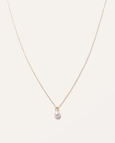 Simple and sophisticated the Dainty Pearl Pendant Necklace is a timeless accessory that effortlessly elevates any look. Wear it alone or layered with other necklaces, you will definitely make a style statement. Classic Yellow Gold Pearl Necklace With Delicate Chain, Dainty 14k Gold Pearl Drop Necklace, Everyday 14k Gold Pearl Chain Necklace, Classic Yellow Gold Pearl Chain Necklace, Classic Gold Charm Necklace With Pearl Drop, Delicate Yellow Gold Charm Necklaces With Pearl Chain, Classic Gold Charm Necklace With Pearl Chain, Dainty Pearl Necklace With Cable Chain As Gift, Classic Gold Pearl Chain Charm Necklaces