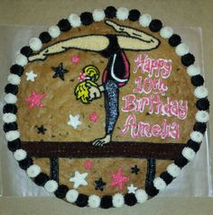 a birthday cake decorated with an image of a woman holding a cheerleader's pom pom