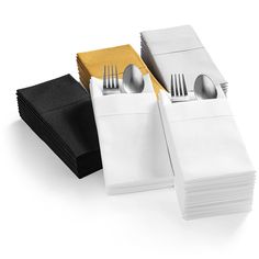 folded napkins with forks and spoons next to each other