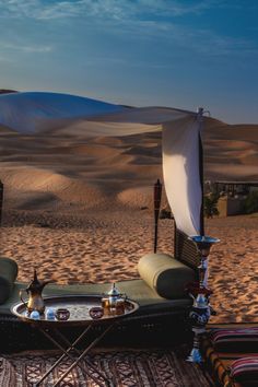 the desert is full of sand dunes and chairs