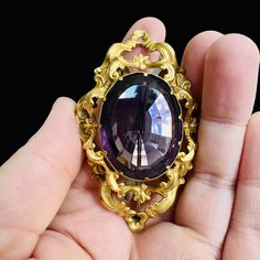 Antique gold filled amethyst glass brooch. Victorian, circa late 1800's. 2.6" inches wide, 1.7" inches long. In very good antique condition, with minor signs of use, as shown. A rare and beautiful piece. Antique Jeweled Brooches For Formal Occasions, Purple Amethyst Brooches For Wedding, Purple Gemstone Brooches For Weddings, Purple Gemstone Brooches For Gift, Purple Gemstone Wedding Brooches, Victorian Jewel Brooches As Gifts, Victorian Jeweled Brooches For Gifts, Victorian Jewel Brooches For Gifts, Antique Jeweled Brooches For Gifts