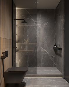 a walk in shower sitting inside of a bathroom next to a wall mounted toilet and sink