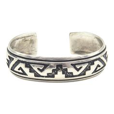 This is part of Chairish’s Costume Jewelry assortment.  Navajo Silversmith Rosita Singer's overlay  sterling silver cuff bracelet featuring a traditional Navajo pattern  The back is marked Singer Sterling.  Interior of the cuff measures 5 1/2" with an additional 1 " gap for a total circumference of 6 1/2".  Sterling Silver is relatively malleable, thus this cuff is slightly adjustable. Width measures 2.53" straight across the widest part (from wrist bone to wrist bone). Bracelet face measures .61" tall (the face of the bracelet, north to south). Bracelet depth from top the underside of wrist is 2". Southwestern Sterling Silver Cuff Bracelet In Silver, Traditional Turquoise Sterling Silver Cuff Bracelet, Native American Silver Bracelet, Chunky Silver Jewellery, Southwest Jewelry Navajo Silver Cuff Bracelets, Navajo Pattern, Southwestern Style Blue Nickel-free Cuff Bracelet, Sterling Silver Cuff Bracelet, Sterling Silver Cuff