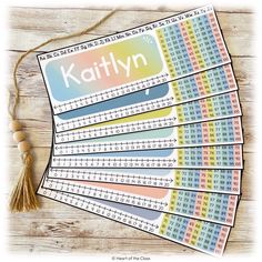 six rulers with the name kittylynn on them and some tassels around it