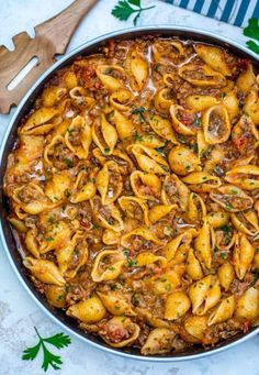 a pan filled with pasta and meat sauce