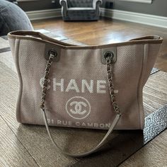 Preowned Please See All Photos Item Will Be Authenticated By Poshmark Upon Purchase And Is Guaranteed Authentic Comes With Authenticity Card Trendy Brown Canvas Vacation Bag, Brown Square Beach Shopping Bag, Chanel Deauville Tote Bag Outfit, Chanel Timeless Tote, Travel Beach, Chanel Deauville Tote Bag, Travel Tote, Chanel Bags, Womens Tote Bags