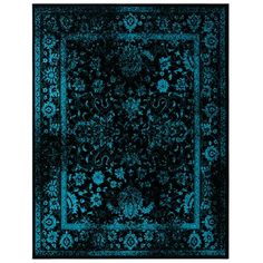 a black and blue rug with an ornate design on the bottom, in front of a white background