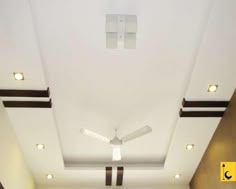 an empty room with white walls and ceiling fan