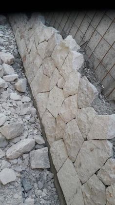 a pile of rocks sitting next to a building