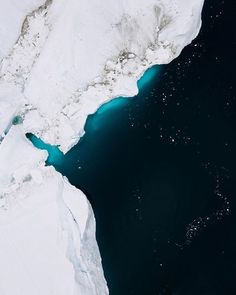 an aerial view of icebergs and water in the arctic ocean, taken from above