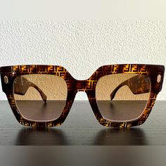 Fendi Bold Low Bridge Fit Havana Acetate Logo Tortoiseshell Sunglasses Perfect Condition And No Scratches On Lenses Or Frames. Unisex! Square Fendi Bold Sunglasses In Havana Acetate With Ff Motif. Temples With Gold-Colored Metal Fendi Lettering. Brown Lenses (Lens Color No Longer Available In Stores) Made In Italy They’re Real. I Honestly Did Not Know They Came With Verification Cards Until I Perused Poshmark And Saw Them Listed Before Listing These . I Know, I Feel A Little Cheated Too And I Wish I Had It To Include. Includes Black Case With Light Pink Suede Lining And Never Opened Matching Cleaning Cloth. Happy To Answer Any Additional Questions Or Requests In Comments! Bold Sunglasses, Tortoiseshell Sunglasses, Tortoise Shell Sunglasses, Pink Suede, I Wish I Had, Black Case, Unisex Sunglasses, Tortoise Shell, Cleaning Cloth