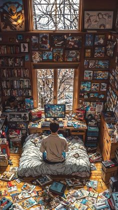 a person sitting on top of a bed in a room filled with books and magazines