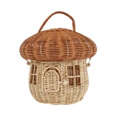 a wicker purse with a handle on the front and side, sitting on a white background