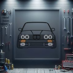 an image of a car in the garage with tools hanging on the wall behind it