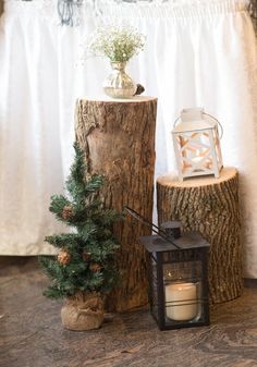 a small tree stump next to a lit candle