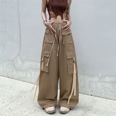 Features: Expertly crafted from 100% pure cotton, these vintage-inspired cargo pants are the perfect addition to any streetwear wardrobe. With an oversized fit and retro design, they offer both style and comfort. Complete with spacious pockets and a casual straight leg cut, these pants are a must-have for any hip hop enthusiast. Celana Kargo, Women Cargo Pants, Cargo Pants Outfit, Baggy Cargo Pants, Dance Pants, Style Cargo Pants, Blouse Tank Top, Cargo Pants Women, Pant Style