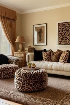 a living room filled with lots of furniture and animal print on the walls, along with large windows