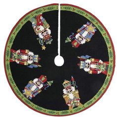 a round christmas tree skirt with santa claus and other holiday decorations on the front, hanging from a hook