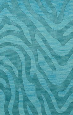 a blue rug with wavy lines on it