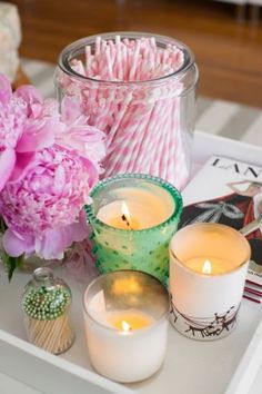 candles, flowers and candy canes on a tray