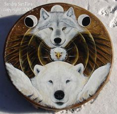 two white polar bears and an eagle painted on a wooden plate in the snow,