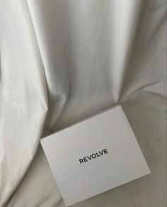 a white sheet with the word revolve written on it