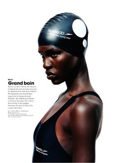 a woman wearing a swimming cap with the words grand boin on it's side