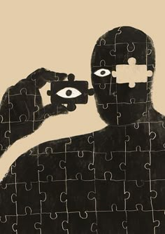 a person holding a piece of puzzle with one eye on it and the other hand in front of their face