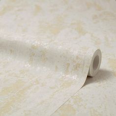 a roll of white paper sitting on top of a table next to a wallpaper