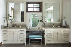 a bathroom with two sinks and mirrors on the wall above it is also a stool