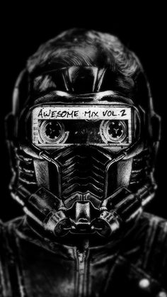 a black and white photo of a man wearing a gas mask with the words awesome mix vol 2 written on it