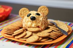 a plate topped with crackers and a mouse face