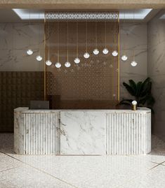 an elegant reception area with marble and gold accents