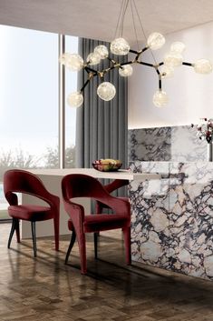 an elegant dining room with marble and red chairs