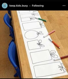 a wooden table topped with lots of writing paper