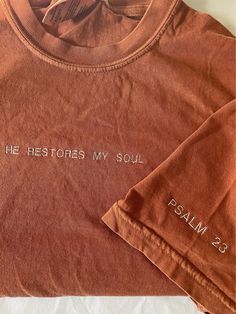 HE RESTORES MY SOUL <3 Inspired by Psalm 23 Embroidered on a comfort color T-shirt color pictured:YAM **Embroidery Listings ONLY (if applicable) Thread color is black for neutral light colors (ivory, Sand)- all other crewneck options that are colors will be white thread unless discussed otherwise. Please be informed that each embroidered item has a stabilizer on the inside of the garment that holds the stitching together, it will soften after 1st wash. If you desire a specific thread color- Mess Give Thanks Shirt, Christian Embroidered Shirts, Cute Christian Outfits, Hand Embroidered Shirts, Waymaker Shirt, Crewneck Designs, Bible Verse Shirts, Church Merch, He Restores My Soul