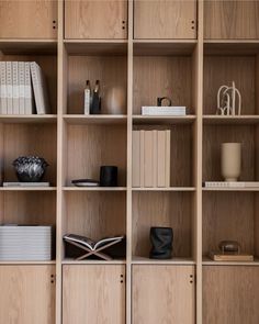 a book shelf with books and other items on it