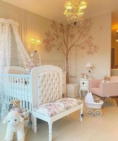 a baby's room is decorated in pink and white