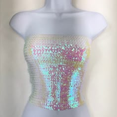 This Opal White Sequin Strapless Tube Top is made with high quality sequins on the outside, as well as polyester on the inside. The size of the tube top is 12 inches wide and 10 inches tall when flat. It is also stretchy and form fitting as well. If you have any questions about our products or have any inquiries please contact us and I will be glad to help. *Since this item is hand-made, the design can vary slightly from the image. Iridescent Clothing, Libra Szn, Selena Museum, Iridescent Fashion, Catty Noir, Sparkly Top, Tube Tops, Opal White