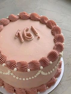 a pink cake with the number forty on it