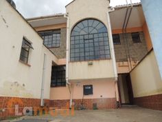 an empty building with large windows on the outside