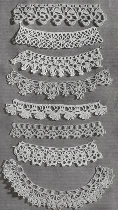 four rows of crocheted lace on a gray background