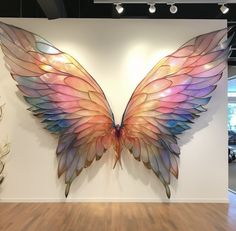 a large colorful butterfly sculpture on display in a building