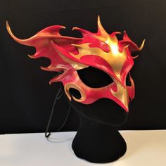 "Rise from the ashes! Red and Gold leather Phoenix mask features special hand-tooling, airbrushed and waterproofed. ORDER ANY COLOR For Fantasy Festivals, FaerieCon, Renaissance Faire, Halloween, Masquerade ball. ♦ COMFORTABLE & ADJUSTABLE ♦ Secured with or without ties for adjustability, supple leather is formed to facial contours. SHOWN IN GLOSSY (Matte available by request.) ORDER ANY COLOR ♦ Match your costume, Free! -- Professionally airbrushed & hand-painted. -- Scroll to end of li Bird Cosplay, Animal Masquerade Mask, Mask Cord, Red Mask, Mask Painting