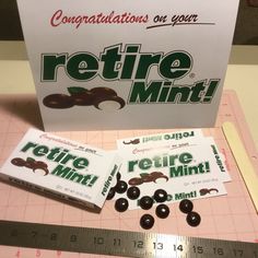 some chocolates are sitting on a cutting board next to a box of mints