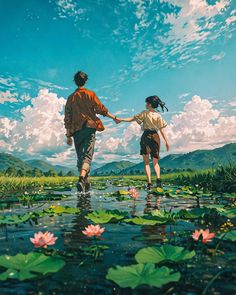 two people holding hands while walking through water lilies