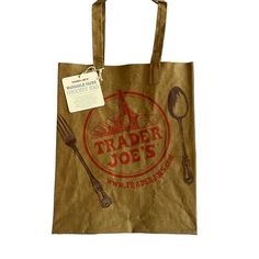 a brown paper bag with a fork and spoon on the front that says trader joe's